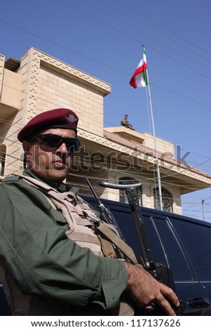 ARBIL, IRAQ -JUNE 11 : Unidentified Kurdish soldier stands guard at a check point on June 11, 2007 in Arbil, Iraq
