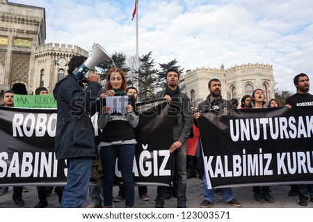 ISTANBUL,TURKEY-DECEMBER 28 : University students staged a protest on the first anniversary of Uludere massacre in front of the Istanbul University on December 28, 2012 in Istanbul,Turkey.