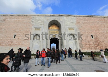 ISTANBUL,TURKEY- FEB 18 :Tourists go through the Gate of Felicity, the entrance into the Inner Court also known as the Third Courtyard in the Topkapi Palace on  February 18, 2013 in Istanbul,Turkey
