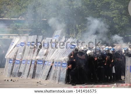 ISTANBUL,TURKEY-JUN E 1: Protesters in Taksim continue as minor scuffles break out and protesters lob fireworks at officers. Police removed barricades around the square on June 1,2013 in Istanbul.