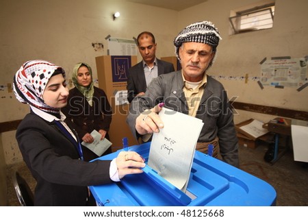 ARBIL - MARCH 07: Kurds flee to election centers to vote for the Iraqi General Elections on March 7, 2010 in the capital of Kurdistan, Arbil, Iraq