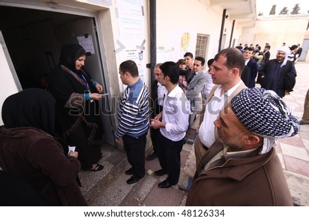 ARBIL-MARCH 07: Kurds flee to election centers to vote for the Iraqi General Elections in the capital of Kurdistan, Arbil. Iraq on March, 07, 2010.