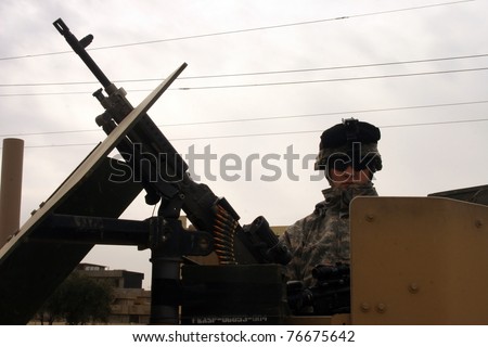 KIRKUK, IRAQ - FEBRUARY 2: Unidentified US soldier stands guard at a check point on February 2, 2007 in Kirkuk, Iraq.