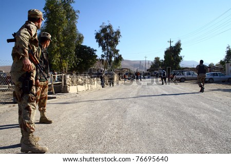 MAXMUR, IRAQ -JANUARY 26 : Unidentified Iraqi soldiers stand guard at a check point on January 26, 2007 in Maxmur, Iraq.