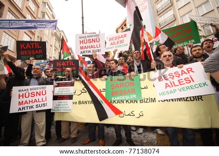 ISTANBUL, TURKEY-MAY 13: Unidentified Syrians living in Istanbul and Civil Society Organizations protest the regime of Bashar Essad in front of Syrian Consulate building on May 13, 2011 in Istanbul, Turkey.