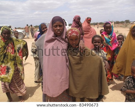 DADAAB, SOMALIA-AUGUST 15: Unidentified woman & children live in the Dadaab refugee camp where thousands of Somalis wait for help because of hunger on August 15, 2011 in Dadaab, Somalia.