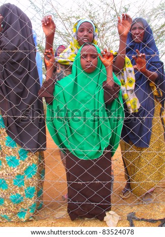 DADAAB, SOMALIA-AUGUST 15: Unidentified women wait for relief aid in the Dadaab refugee camp where thousands of Somalis end up due to hunger on August 15, 2011 in Dadaab, Somalia.