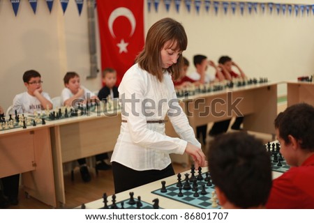 ISTANBUL, TURKEY, SEPTEMBER 29: World Chess Champion Elisabeth Paetz played with unidentified children at Istanbul Junior Chess Championship on September 29, 2011, Istanbul