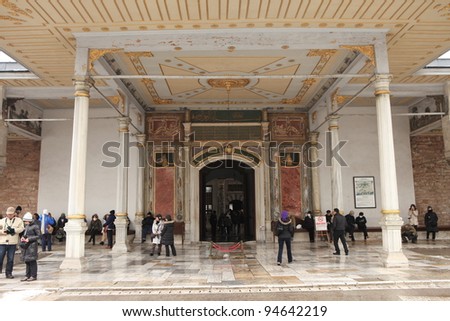 ISTANBUL,TURKEY- JANUARY 28 :Tourists go through the Gate of Felicity, the entrance into the Inner Court also known as the Third Courtyard in the Topkapi Palace on January 28, 2012 in Istanbul,Turkey