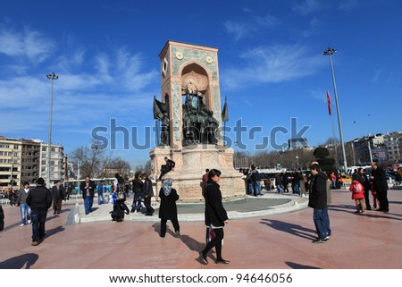 ISTANBUL,TURKEY- FEBRUARY 5: People walk around Republic Monument at Taksim Square on Feb 5, 2012 in Istanbul. The monument honoring the leaders of the struggle for independence was unveiled in 1928.