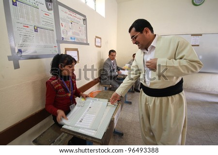 ARBIL, IRAQ - MARCH 07: Kurds flee to election centers to vote for the Iraqi General Elections on March 7, 2010 in the capital of Kurdistan, Arbil, Iraq