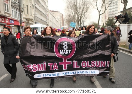 ISTANBUL,TURKEY-MARCH 8: Unidentified women in purple costume celebrates international women\'s day on March 8,2012,in Istanbul,Turkey
