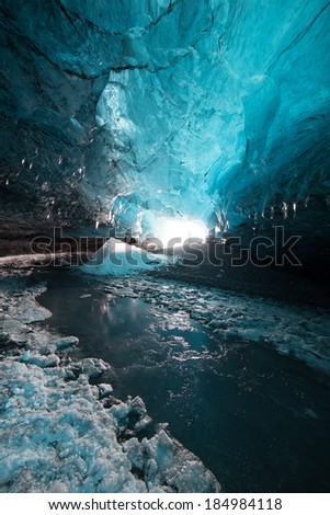 Inside an icecave in Vatnajokull, Iceland.  The ice is thousands of years old and so packed it is harder than steel and crystal clear.