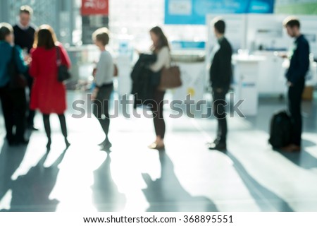 out of focus shot of people waiting in line