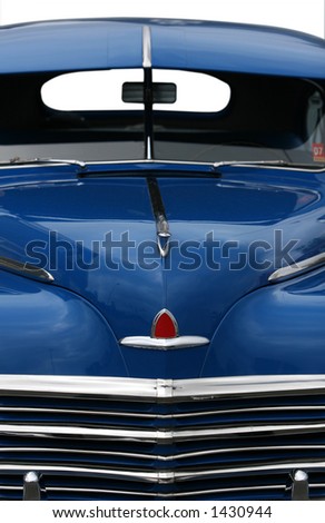 photograph of the front end of an old classic car in mint condition, shining chrome and highly polished finish , absolutely beautiful, cropped shot isolated with clipping paths