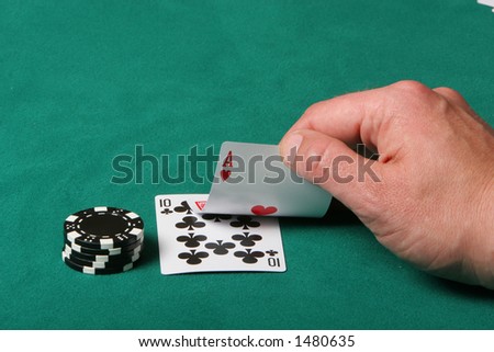 Cards in a black jack game, player checking his hand