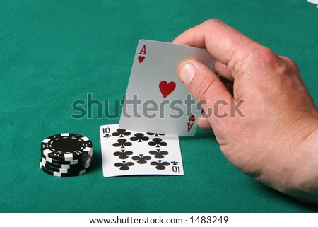 Cards in a black jack game, player checking his hand, getting a fantastic card