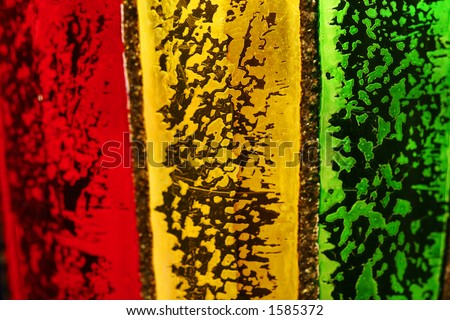 Colored glass red, green and yellow, backlit with gold flakes on glass