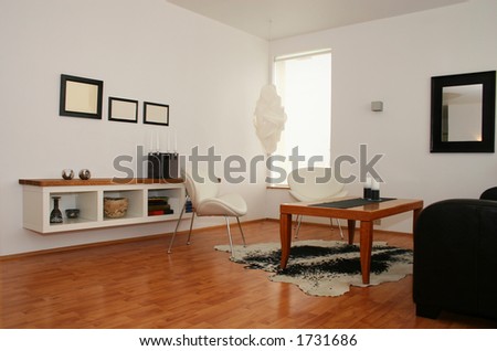 A living room in a trendy, modern household, design and looks well thought out
