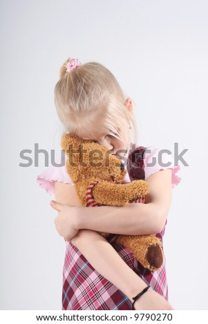 girls with teddy bears. holding her teddy bear