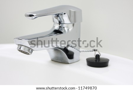 chrome faucet on a sink, no running water