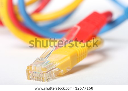 Category 5 network cables isolated on white, three different colors,red,blue and yellow