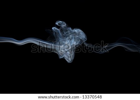 Abstract smoke shot on black, smoke seems to form a knot in the middle