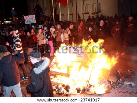 REYKJAVIK, ICELAND - JANUARY 21, 2009:  Protesters build fires at the riots during protests against the Icelandic government\'s handling of the economy on January 21, 2009.