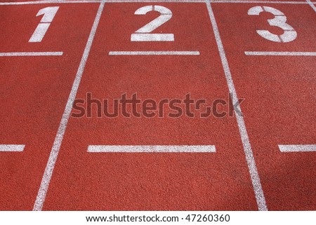 Lanes 1, 2 and 3 on a running track, great texture and detail in the ground of the track