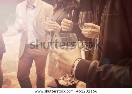 people drinking wine vintage effect, a group of friends is socializing and having a fun