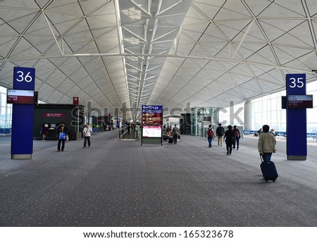 HONG KONG, CHINA - NOVEMBER 16: Airport gates on November 16, 2013 in Hong Kong, China. The airport is also colloquially known as Chek Lap Kok Airport as it is located in island of Chek Lap Kok.
