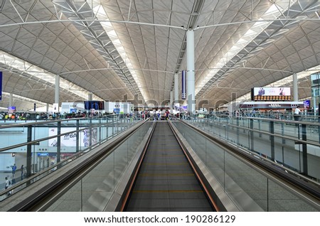 HONG KONG, CHINA - APRIL 19: Airport lobby on April 19, 2014 in Hong Kong, China. The airport is also colloquially known as Chek Lap Kok Airport as it is located in island of Chek Lap Kok.
