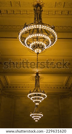 NEW YORK - SEPTEMBER 20: Chandeliers in Grand Central Station, the largest train station in the world by number of platforms, 44, with 67 tracks, on September 20, 2014 in New York.