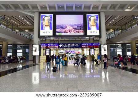 HONG KONG, CHINA - NOVEMBER 23: Passengers in the airport lobby on November 23, 2014 in Hong Kong, China.