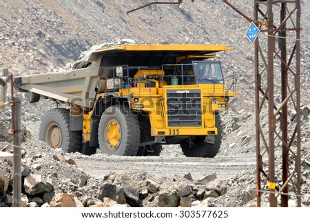 Kremenchug, Ukraine - 26 June 2010. Yellow dump truck Komatsu, driving on a road in a stone quarry