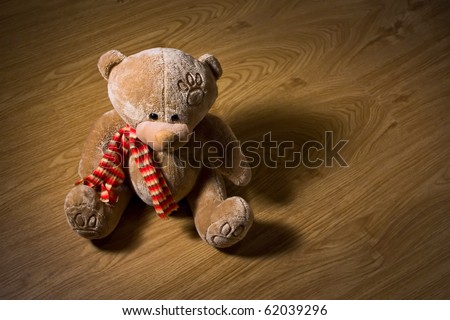 Teddy bear on wood floor
