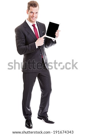 He knows what is good for you! - full length shot of a confident young businessman presenting empty space on a modern tablet pc