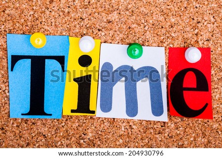 The word Time in cut out magazine letters pinned to a cork notice board