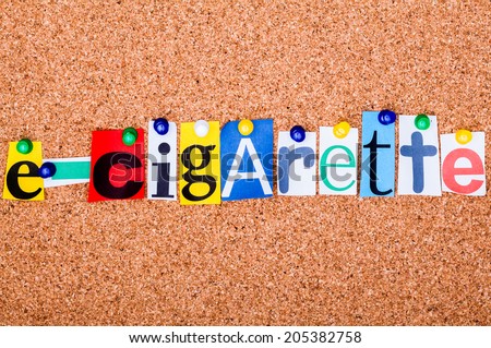 The word e-cigarette  in cut out magazine letters pinned to a cork notice board