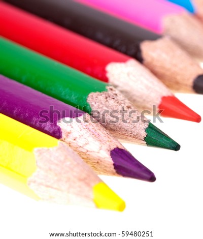 Colorful Crayons - completely isolated on white background, much space for own text. Very shallow depth of field