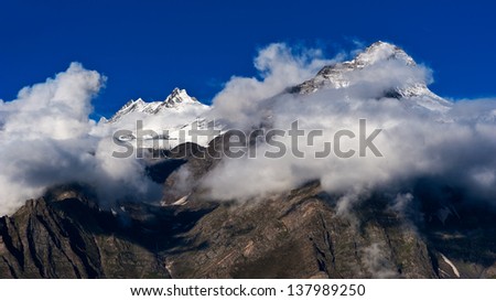 Himalaya high mountain landscape panorama with snow cup at dawn. India, Himachal Pradesh, Keylong village
