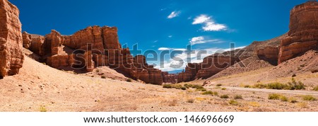 Charyn Canyon Under Blue Sky. State National Paleontology Park In Kazakhstan. Three Images Panorama