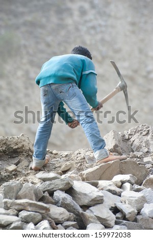 Keylong, India - September 06: Unidentified Indian Man From Poorest State Bihar, Working At Road Construction Near Keylong Village, Manali-Leh Highway. India, Himachal Pradesh, September 06, 2012