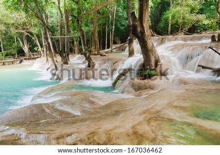 Jangle landscape with Kuang Si cascade waterfall at tropical rain forest near Luang Prabang, Laos