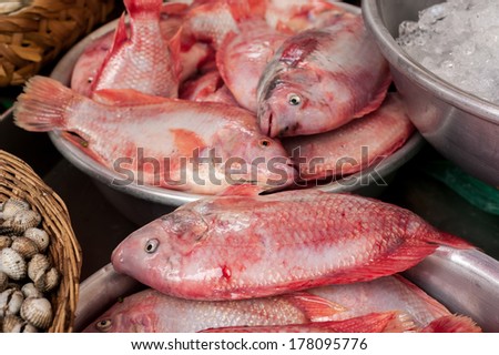 Raw fresh seafood, fish and clams for sale at asian food market