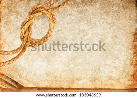 Grunge texture of old book paper sheet and hemp rope with space for your text