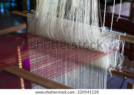 Vintage manual weaving loom with unfinished textile work