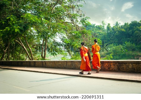 Young buddhist monks at city street. Luang Prabang, Laos travel landscape and destinations