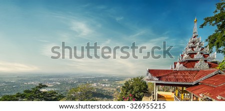Mandalay cityscape view from Mandalay Hill with Su Taung Pyai Pagoda. Myanmar (Burma) travel landscapes and destinations