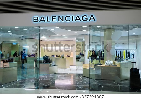 HONG KONG - 22 JAN, 2015: Balenciaga fashion boutique display window with mannequin in luxury clothes and accessories for exclusive shopping. Founded in 1919 by Cristobal Balenciaga, Spanish designer